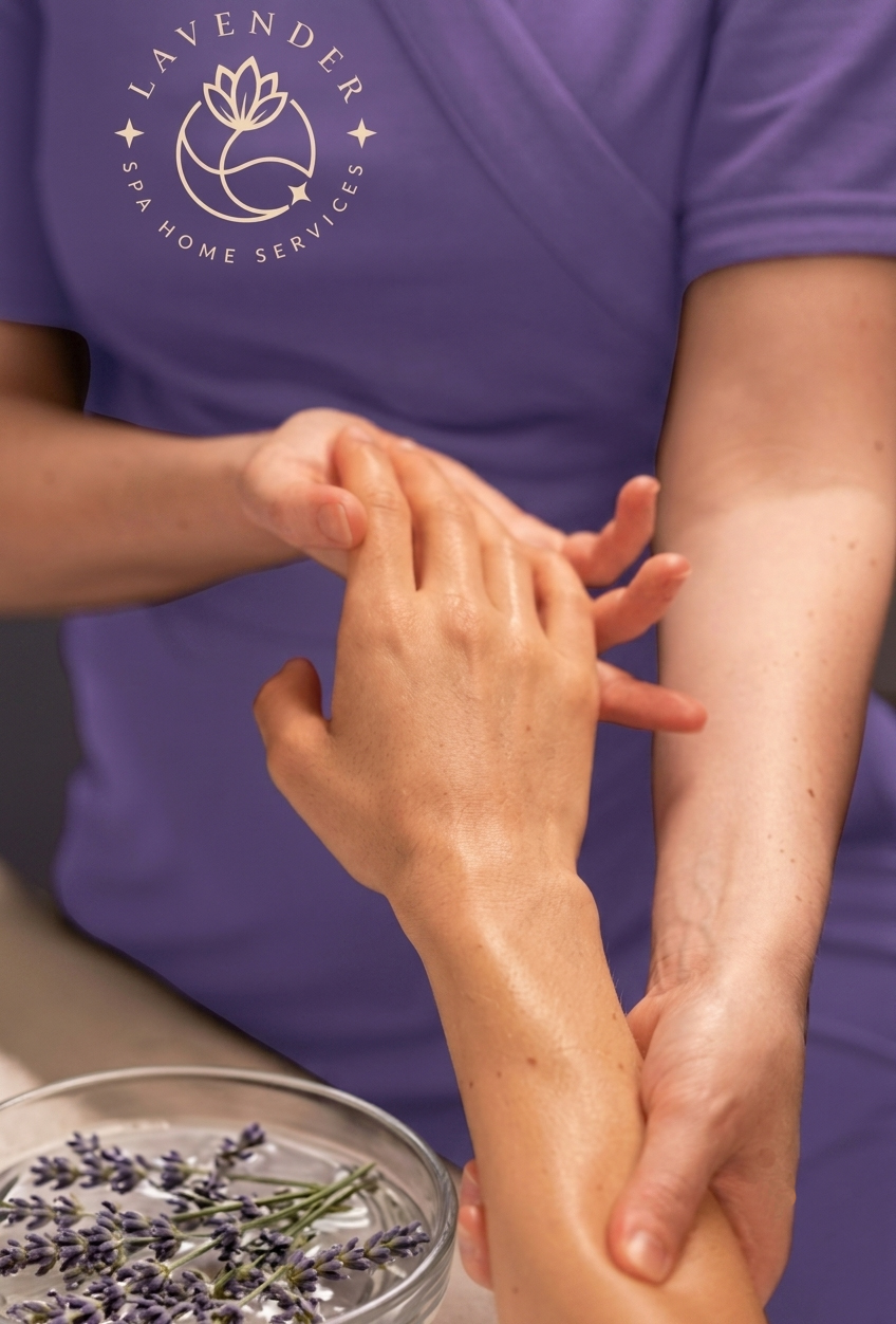 Lavender SPA branded therapist performing a hand massage with lavender